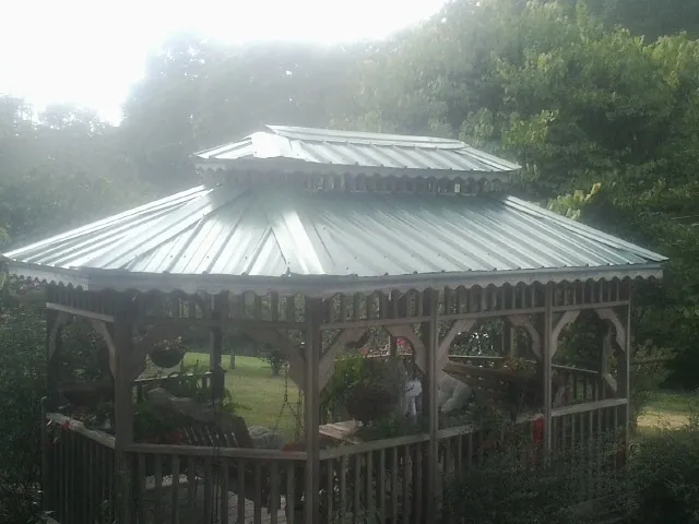 Two tier green metal roof on a garden gazebo in Selbyville